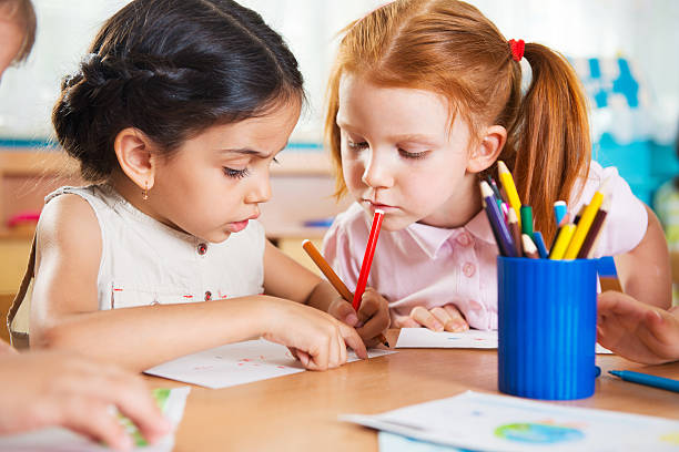 istock Cute preschoolers drawing with colorful pencils 178614600