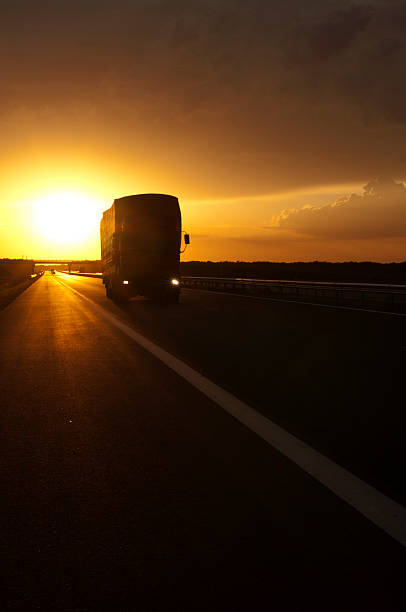 istock Truck traveling at sunset 178614885