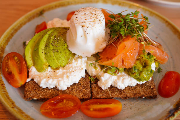 istock Cottage cheese, avocado, and smoked salmon cracker with poached egg on top 1786153280