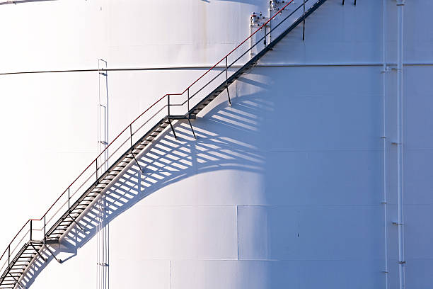 istock white tanks in tank farm with blue sky 178615380