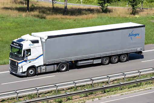 Engelskirchen, Germany - June 24, 2020: Integre Trans Volvo FH truck with curtainside trailer on motorway