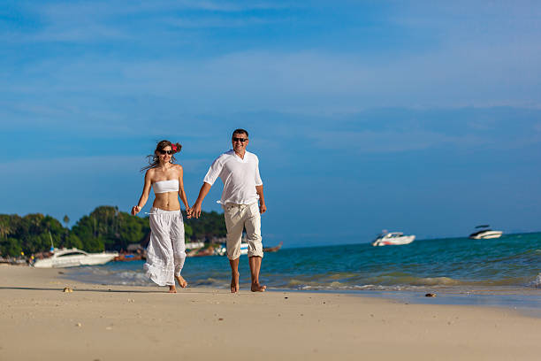 istock couple on a tropical beach 178615483