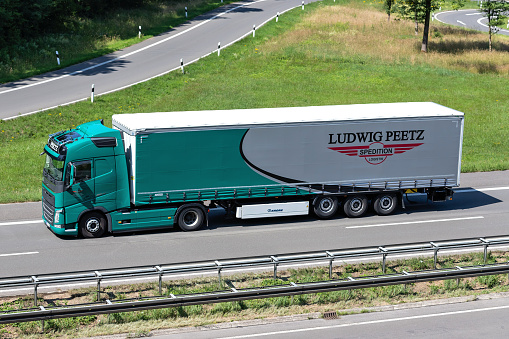 Engelskirchen, Germany - June 24, 2020: Ludwig Peetz Volvo FH truck with curtainside trailer on motorway