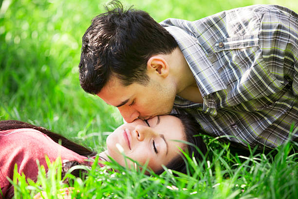 istock Couple Relaxing on Green grass 178617451