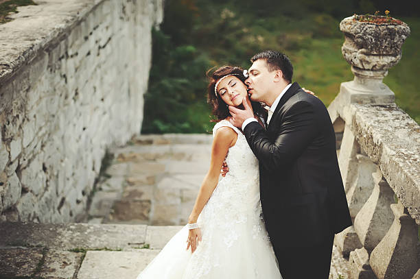 istock wedding couple next to castle in west Ukraine 178618116