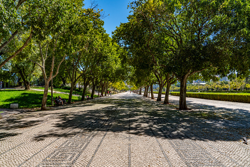 Tourists are visiting Marques do Pombal square and Edward vii Park, Lisbon, Portugal.