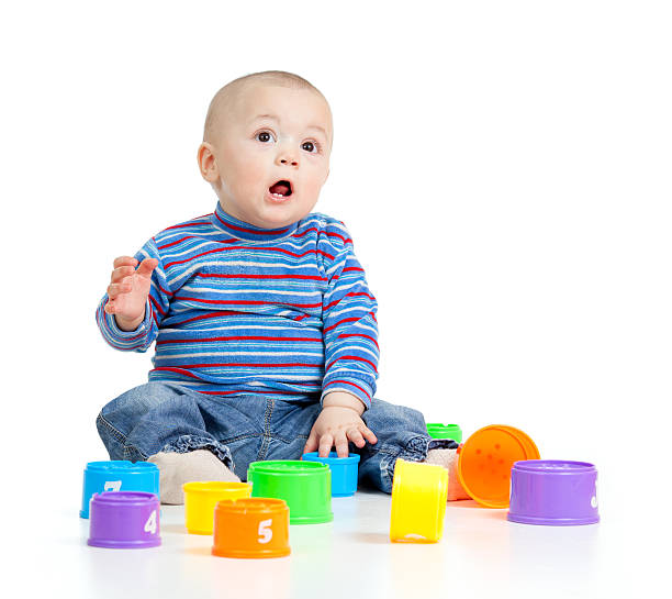 istock Funny baby playing with toys 178618595