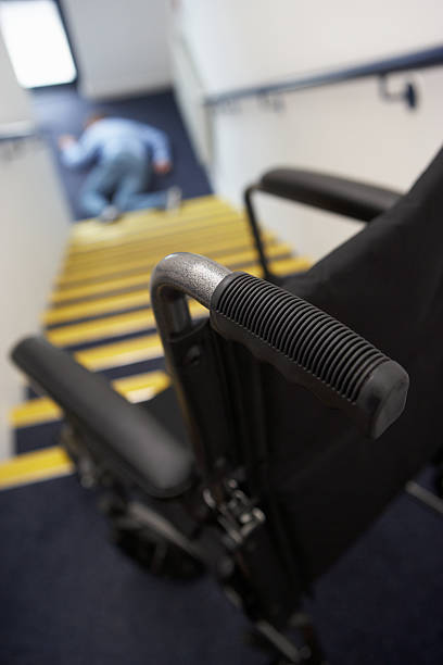 istock Man in wheelchair falling downstairs 178618993