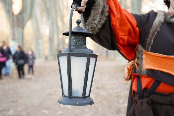 Coal man showing a lantern at carnivals in a costume. Olentzero outfit in spanish tradition