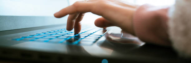 istock Low angle closeup view of female hand working on laptop computer 1786194282