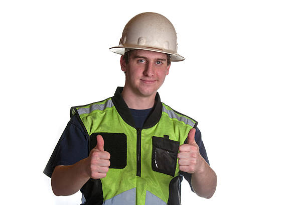 travailleur de la construction dans un gilet de sécurité - thumbs up repairman human thumb electrician photos et images de collection