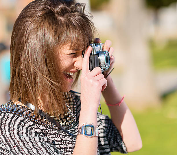istock Woman Capturing Photo With Camera 178619591