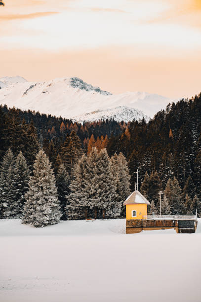 istock a small house on a dam on a swiss mountain lake 1786198511
