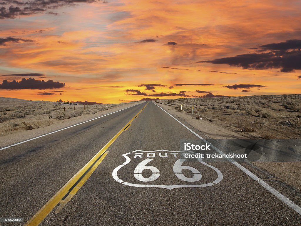 Route 66 Pavement Sign Sunrise Mojave Desert Route 66 pavement sign sunrise in California's Mojave desert. Route 66 Stock Photo