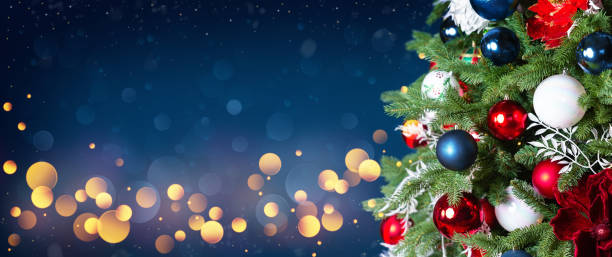 istock Christmas tree with ornaments, balls and lights on dark blue background. 1786202132