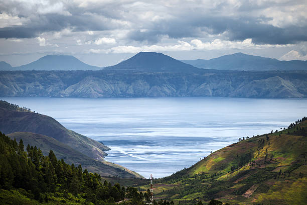 Lake Toba Danau Toba is a lake and supervolcano. Midday view over the largest lake in Indonesia and the largest volcanic lake in the world. lake toba indonesia stock pictures, royalty-free photos & images