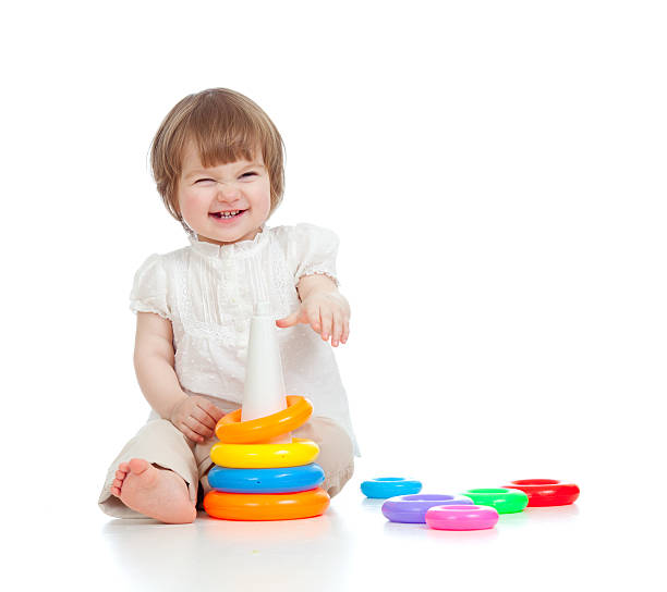 istock cheerful child playing with colorful toy isolated on white 178621763