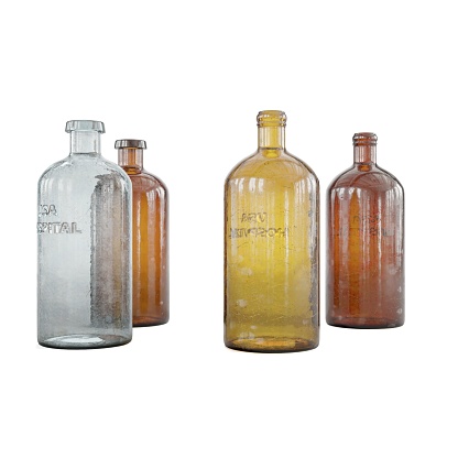 Three vintage glass bottles of varying sizes and shapes, isolated against a white background