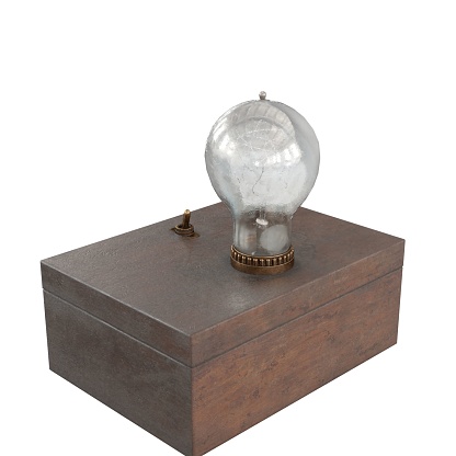 A small, white light bulb inside of a wooden box sits atop a wooden table