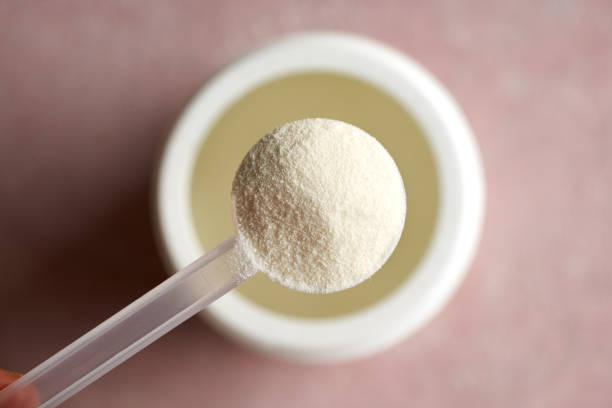 istock Collagen powder in a plastic measuring cup above a plastic jar 1786242938