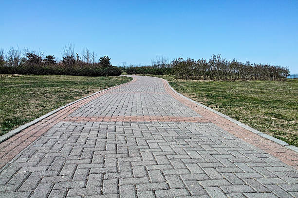 istock Road made by bricks at the grassland 178624627