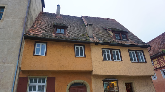 Rothenburg ob der Tauber, Germany - October 20, 2023:The facades of historical buildings at Rothenburg ob der Tauber where is the fortified city in Germany.