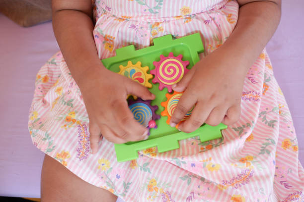 istock preschool child playing colorful shapes 1786259500