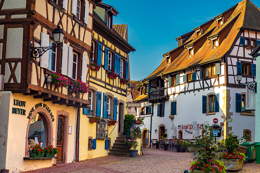 Colorful fairytale half-timbered houses of Alsace in the streets of the village of Eguisheim