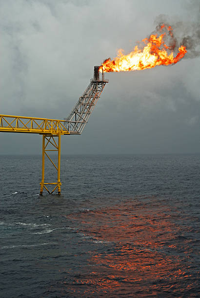istock Flare boom nozzle and fire on offshore oil rig 178627468