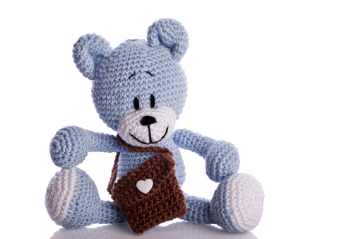 blue teddy bear with brown school bag