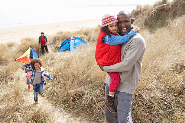 istock Family Having Fun With Kite In Sand Dunes 178628992