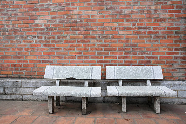 istock Old chairs near grungy red brick wall 178629010