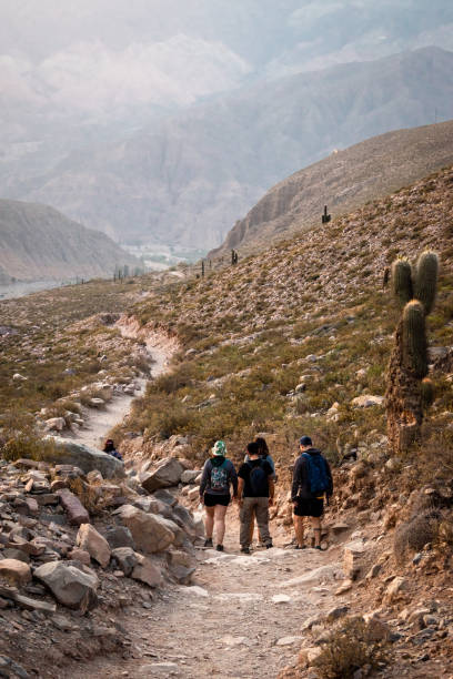 istock Small group of people walking in the mountains. 1786290807
