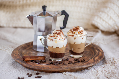 Chocolate espresso coffee mousse dessert cup with whipped cream and cinnamon
