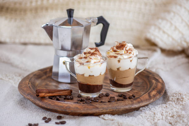 Chocolate espresso coffee mousse dessert cup with whipped cream and cinnamon stock photo