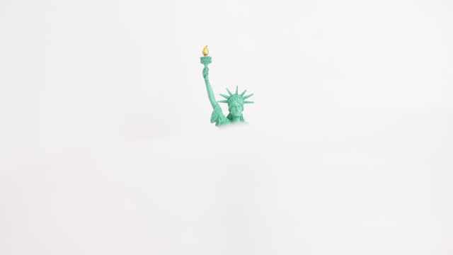 Statue of liberty with thin nylon on white background.