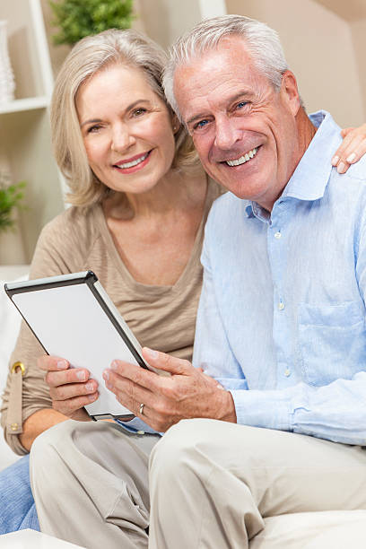 istock Happy Senior Man & Woman Couple Using Tablet Computer 178629367