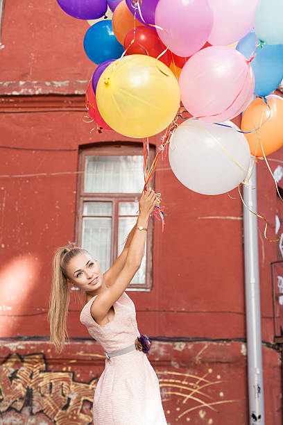 istock woman with balloons 178629520