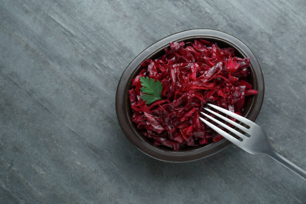 istock Tasty red cabbage sauerkraut with parsley on grey table, top view. Space for text 1786295210