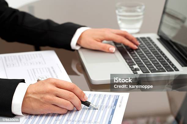 Female Hands Reviewing Documents Stock Photo - Download Image Now - Document, Human Hand, Validation