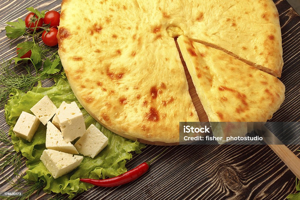 Ossetian Feta Cheese Pie. Traditional Ossetian feta cheese pie still life. Allspice Stock Photo