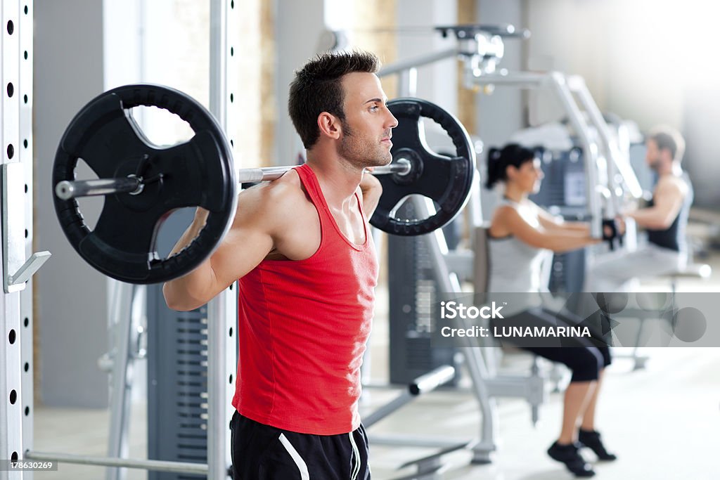 man with dumbbell weight training equipment  gym group with dumbbell weight training equipment on sport gym Men Stock Photo