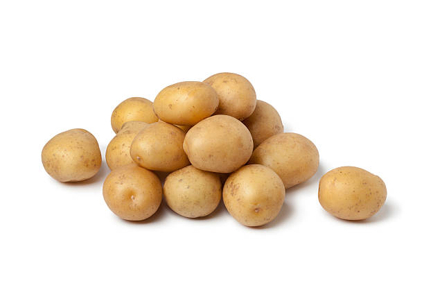 Small new potatoes Small new potatoes on white background raw potato stock pictures, royalty-free photos & images