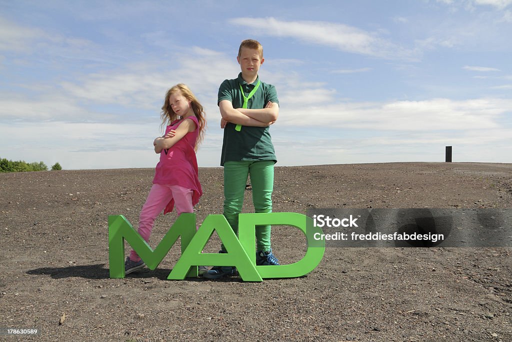 madness rules "two crazy teenies showing they rule the mad world, main focus on the letters" Bizarre Stock Photo