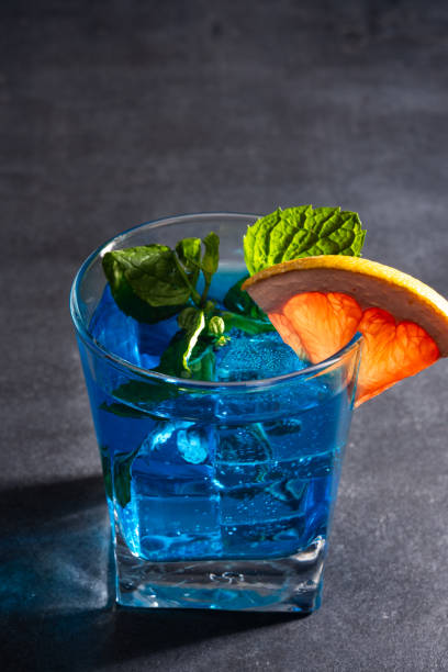 ガラスに入った青色の飲み物 - liqueur color image isolated nobody ストックフォトと画像