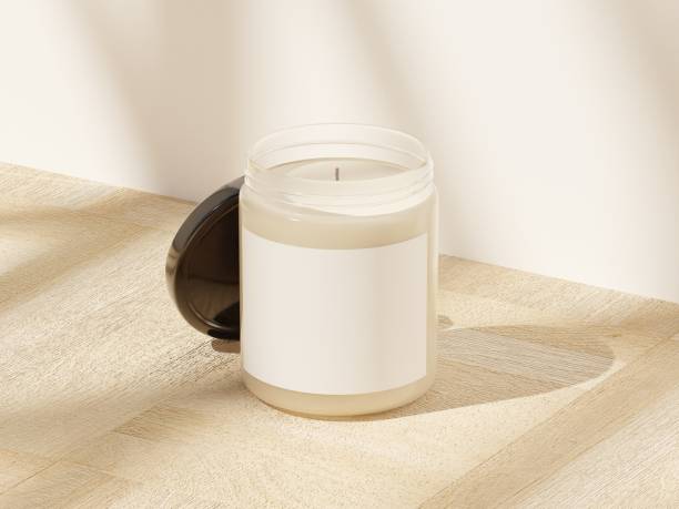 Scented glass candle mockup isolated with soft window shadows on a wooden surface