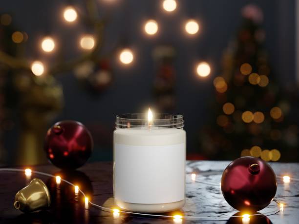 Scented glass lit candle mockup with bright lights unfocused in a Christmas scene Realistic scented glass lit candle mockup with bright Lights Unfocused. Blank label for logo, text or design in a Christmas scene as 3d rendering. Christmas  Customize the Scent stock pictures, royalty-free photos & images