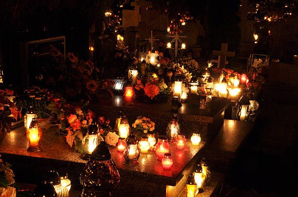istock Candle flames illuminating on cemetery during All Saint's Day 178631492