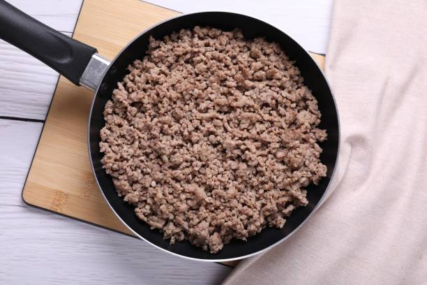 istock Fried minced meat in pan on white wooden table, top view 1786315601