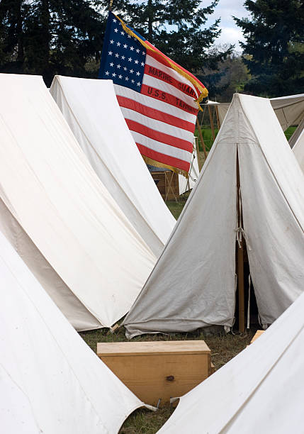 istock Military Camp Canvas Sleeping Tents American Flag Ammo Boxes 178631929
